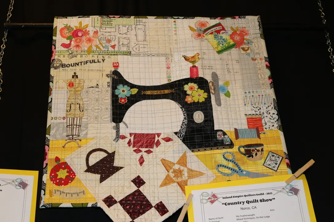 Handmade fabric art featuring sewing machine
