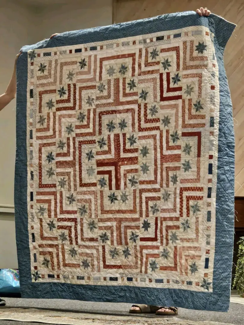 Handmade quilt with star and stripe patterns