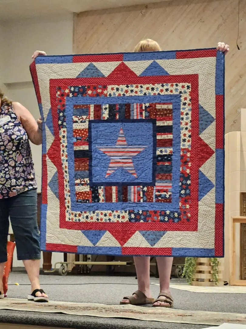 Patriotic quilt with red, white, and blue colors