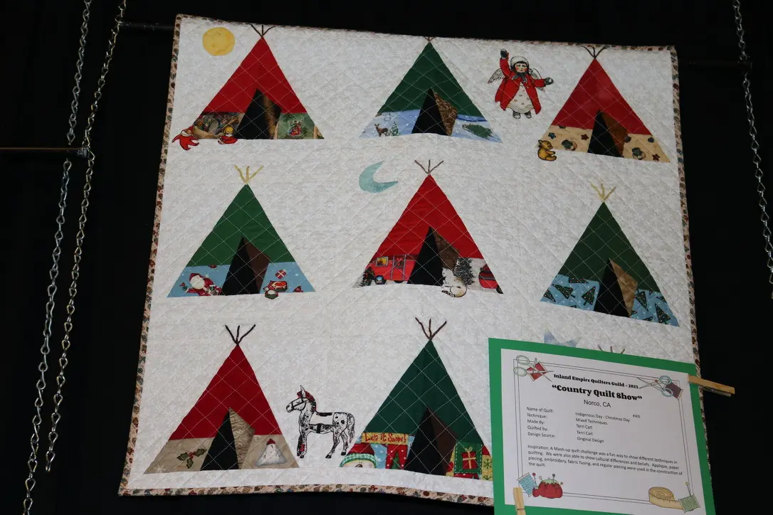 Handmade quilt with colorful tent designs