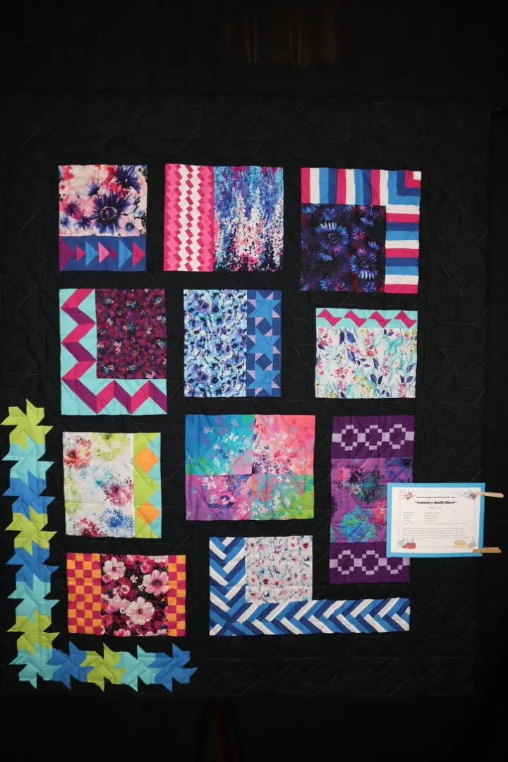 Before and after: Quilted wall hanging on a wall next to a table